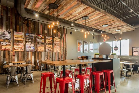 Capriotti's sandwich franchise interior store shot with tables