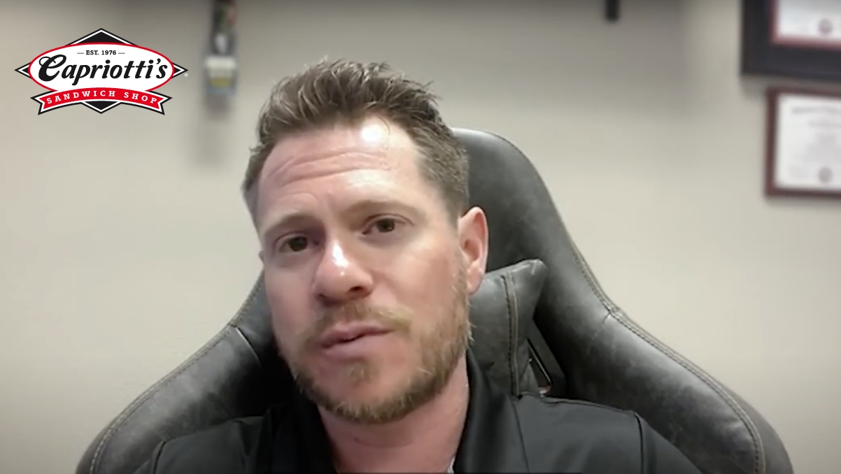 Jason Smylie sitting in leather chair