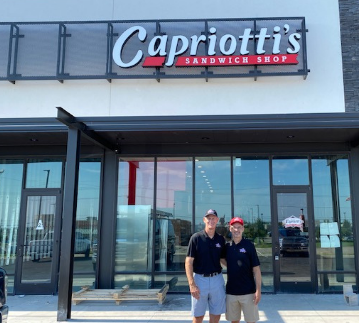 Stan & Glen in front of their Capriotti's franchise
